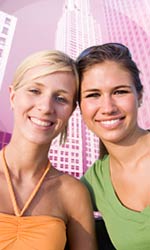 Two women smiling - part of '24 in 2010' banner