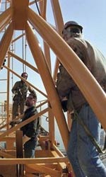 Construction workers atop a structure