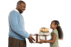 A Father giving presents to his daughter