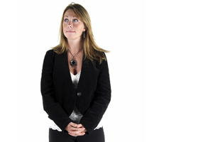 A woman in business attire waiting