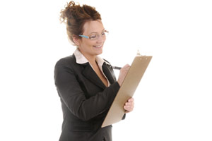 A woman holiding a clipboard