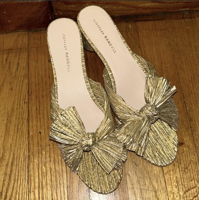 Gold high heel shoes with bowl