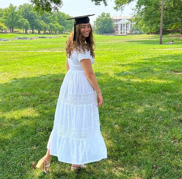 Women wearing a white dress standing outside
