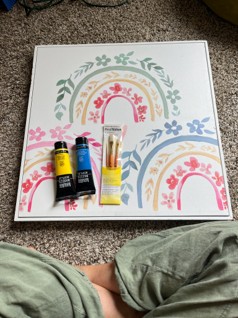 White picture canvas painted with blue green pink and yellow flowers