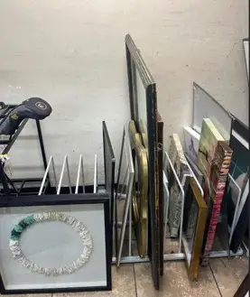 Thrifted Frames on a stand on the Ground